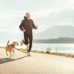 Man runs with his beagle. Use dog-friendly exercises to get fit with your dog.
