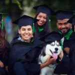 Graduates celebrate with Husky dog wearing a graduation cap. When you train your pet for college, scope out your living situation to make sure it’s suitable for the animal’s size and nature.