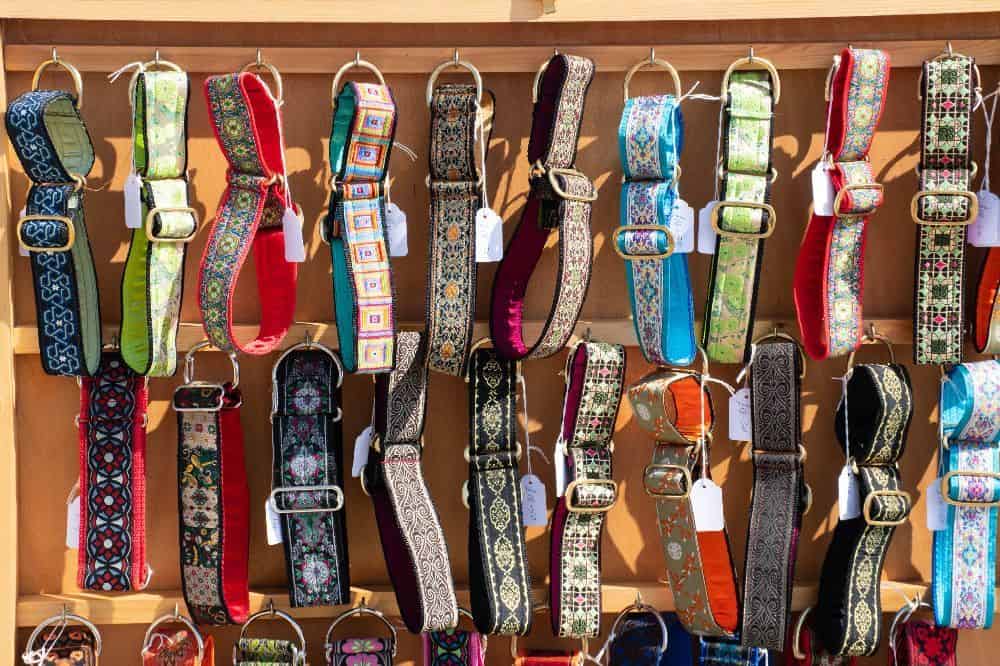 Selection of dog collars at a pet store. Once you have your pup's neck measurement, it's time to choose the right collar. There are a variety of styles and materials available, so take some time to consider which one is best for your pup.